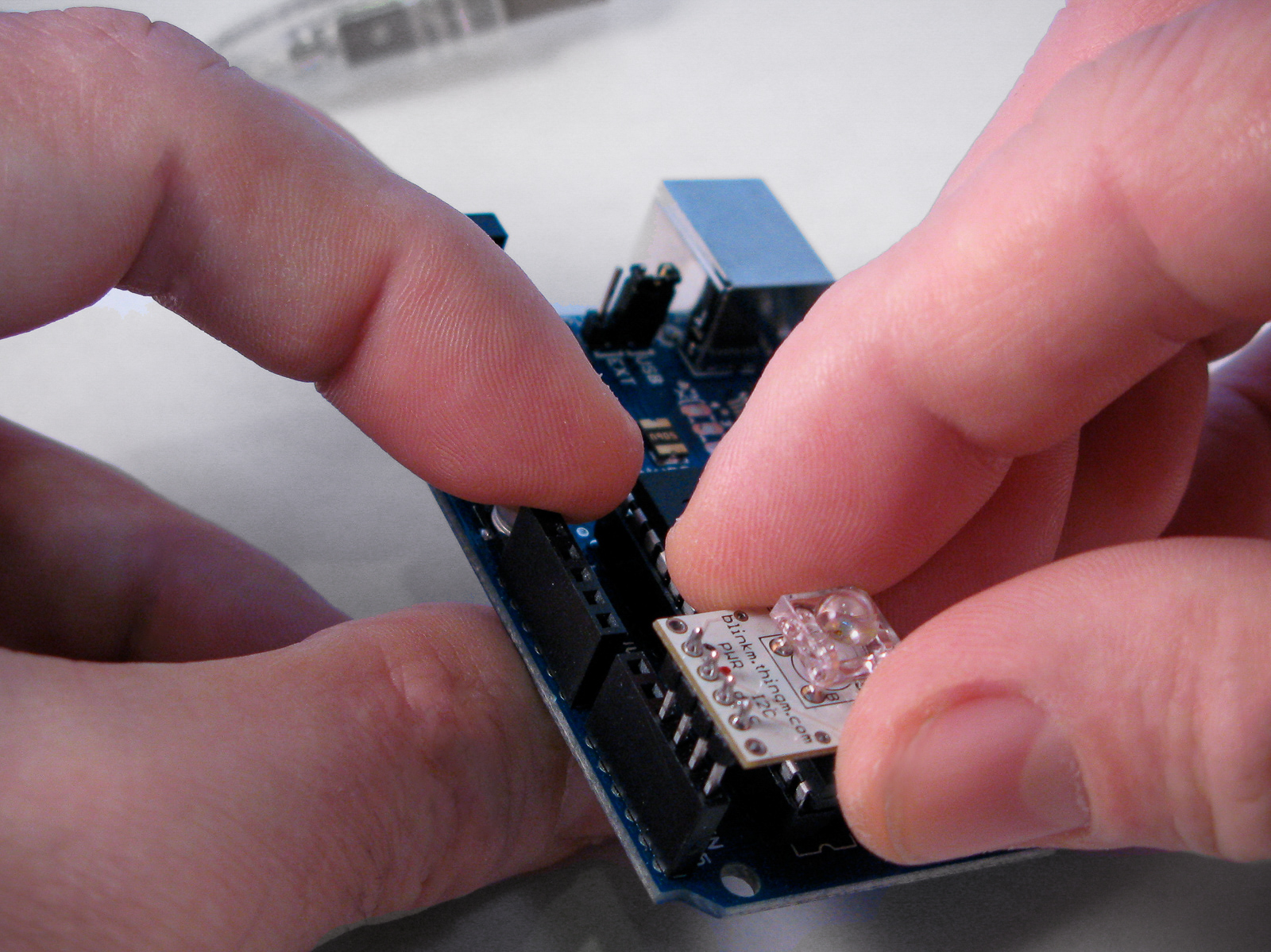 Blink M being installed on an Arduino